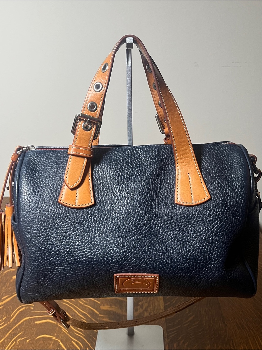 Dooney & Bourke Kendo Navy Pebbled Leather Satchel with Tan Leather Trim/Tassel.